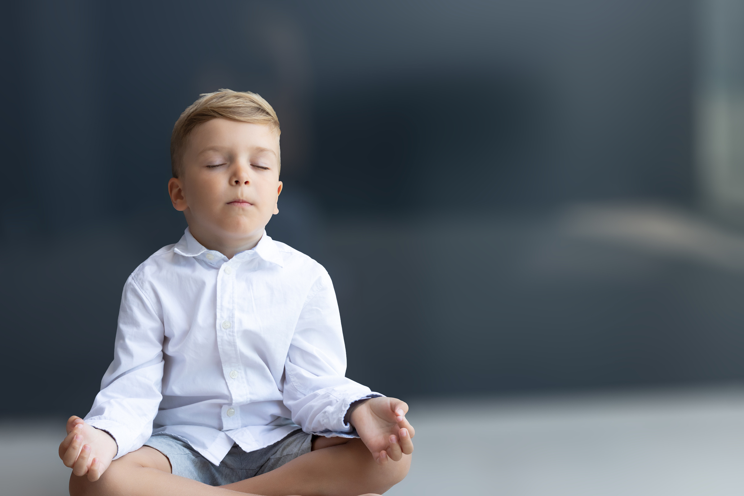 Zen-like Boy Meditating with Eyes Closed.